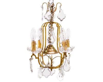 Lot 71 - A brass and glass four branch electrolier.