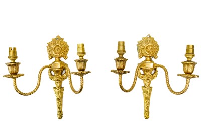 Lot 75 - A pair of gilt brass twin branch wall lights.