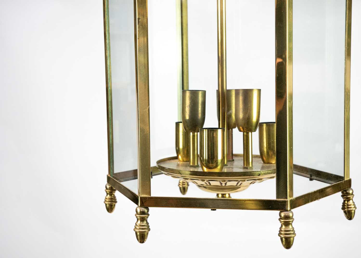 Lot 74 - A pair of glazed brass hexagonal hall lanterns.