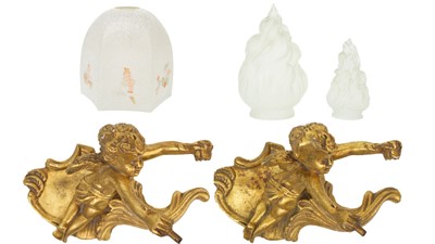 Lot 76 - A pair of gilt plaster cherub wall lamps.