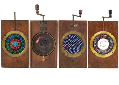 Lot 99 - A set of three mechanical chromotrope double rackwork magic lantern slides.
