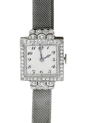 Lot 119 - GOLDSMITH'S & SILVERSMITH'S COMPANY - An Art Deco 18ct white gold and diamond set cocktail bracelet watch.