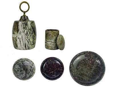 Lot 73 - A Cornish serpentine door stop with brass loop handle.