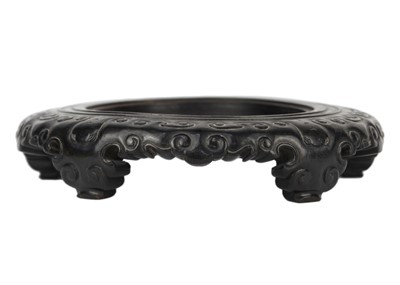 Lot 1041 - A Chinese carved hardwood stand, Qing Dynasty, 19th century.