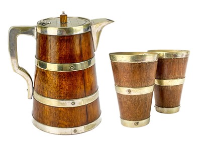 Lot 51 - An Edwardian oak coopered ale jug.