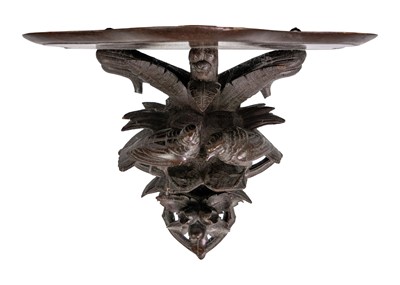 Lot 31 - A Black Forest carved wall bracket.