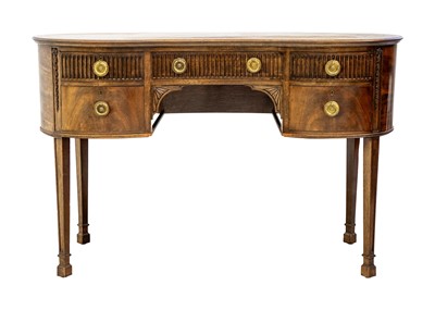 Lot 611 - A George III style mahogany kidney shaped desk.
