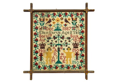 Lot 1592 - A Victorian cross stich wool work sampler.