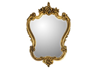 Lot 484 - A gilded carved oak wall mirror.