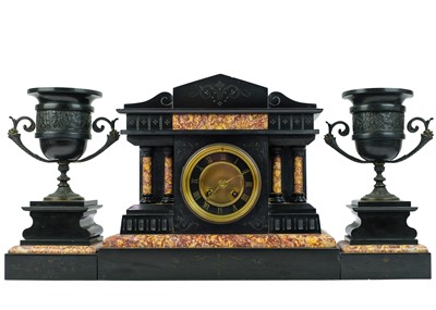 Lot 61 - A French black slate and marble clock garniture.