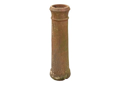Lot 563 - A tall terracotta chimney pot.