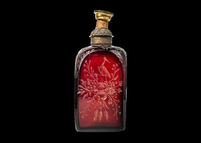 Lot 332 - An early 18th century ruby glass decanter, etched with exotic birds, flowers and foliage.
