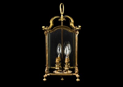 Lot 472 - A brass four light hall lantern.