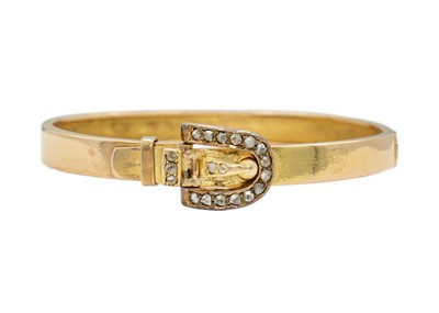 Lot 83 - A Victorian gold hinged bangle diamond set with a buckle design clasp, signed DENIS BRO.