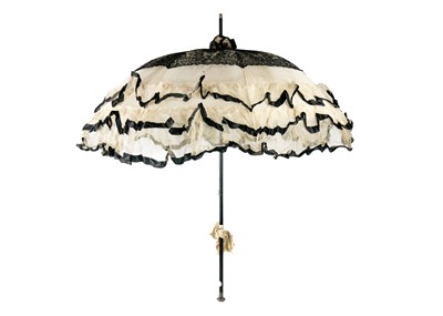 Lot 505 - A Victorian silk and lace parasol.