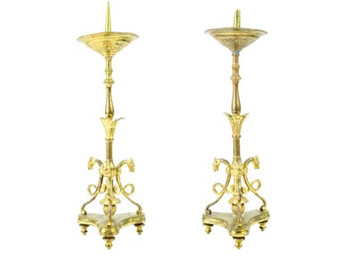 Lot 52 - A pair of brass pricket type ecclesiastical candlesticks.
