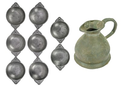 Lot 75 - A set of seven 20th century twin handle pewter porringer bowls with pierced handles.
