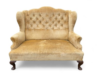 Lot 1659 - A Queen Anne style two seater wing back sofa.