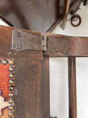 Lot 1019 - A 19th century French oak reclining armchair.
