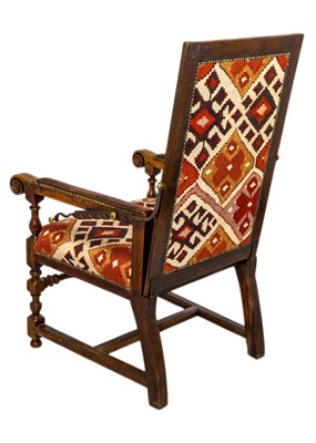 Lot 1019 - A 19th century French oak reclining armchair.