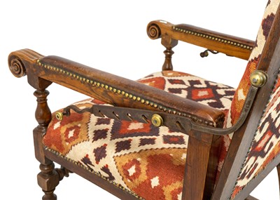 Lot 1019 - A 19th century French oak reclining armchair.