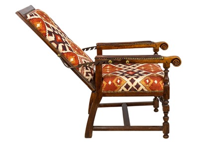 Lot 1019 - A 19th century French oak reclining armchair.