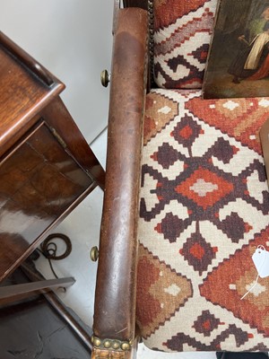 Lot 1019 - A 19th century French oak reclining armchair.