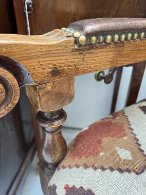 Lot 1019 - A 19th century French oak reclining armchair.