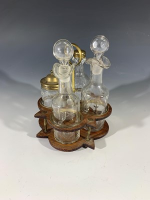 Lot 14 - A Georgian style four bottle cruet with brass...