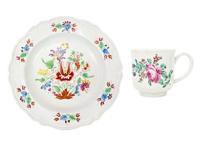 Lot 1030 - A polychrome decorated coffee cup.