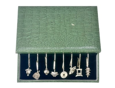 Lot 658 - A set of eight Japanese Sterling silver picks, cased.