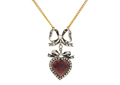 Lot 37 - A diamond, garnet and split pearl set heart and bow design pendant necklace.