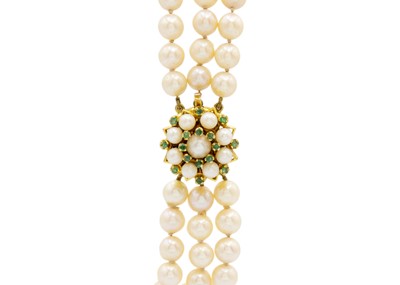 Lot 132 - A triple row cultured pearl bracelet with 9ct emerald and pearl set cluster clasp.