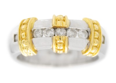 Lot 134 - A modern 18ct white and yellow gold seven stone diamond ring.