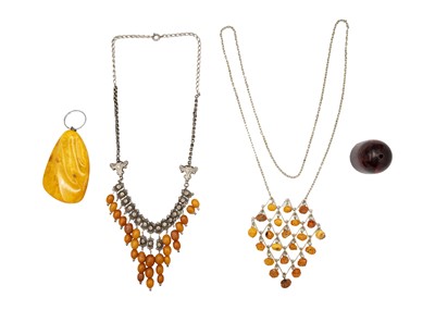 Lot 302 - A selection of amber jewels.