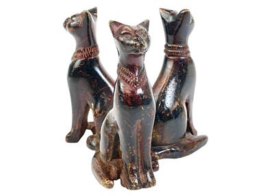 Lot 35 - An Egyptian bronze group of three cats.