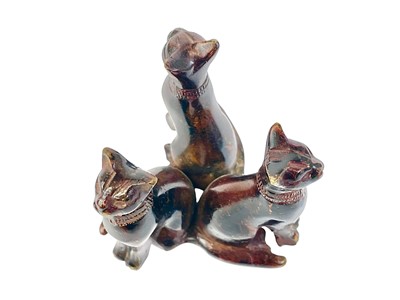Lot 35 - An Egyptian bronze group of three cats.