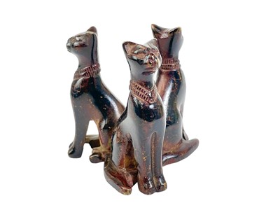 Lot 35 - An Egyptian bronze group of three cats.