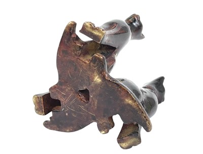 Lot 35 - An Egyptian bronze group of three cats.