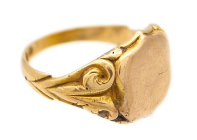 Lot 36 - An 18ct hallmarked gold and 9ct shield front gentleman's signet ring.