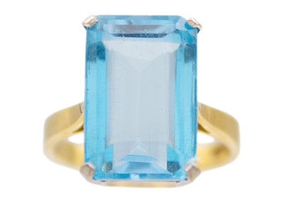 Lot 65 - An 18ct yellow and white gold, blue topaz set cocktail ring.