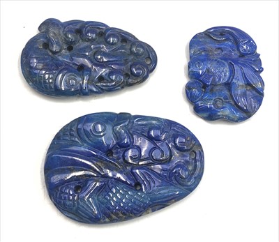 Lot 303 - Three Chinese lapis lazuli pendants, each...