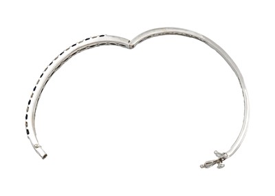 Lot 42 - A  good modern 14ct white gold diamond and sapphire set hinged bangle with matching earrings.