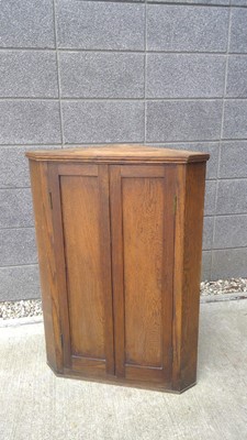 Lot 26 - An Oak, Corner Cupboard. The Cupboard measures...