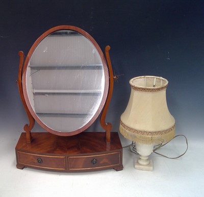Lot 134 - A toilet mirror and a Stone Base Lamp. The...
