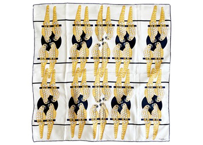 Lot 210 - CARTIER - A silk printed scarf decorated with diamond set parrots.