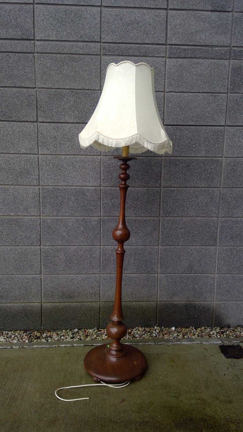 Lot 47 - A Turned Mahogany Lamp Stand. The Stand is...
