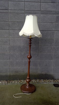 Lot 47 - A Turned Mahogany Lamp Stand. The Stand is...