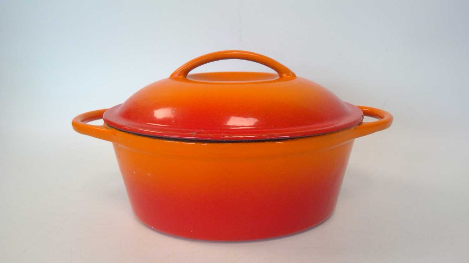 Lot 36 - An orange cast iron lidded dish, 32cm x 22cm x...