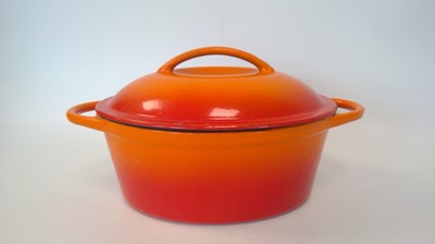 Lot 36 - An orange cast iron lidded dish, 32cm x 22cm x...